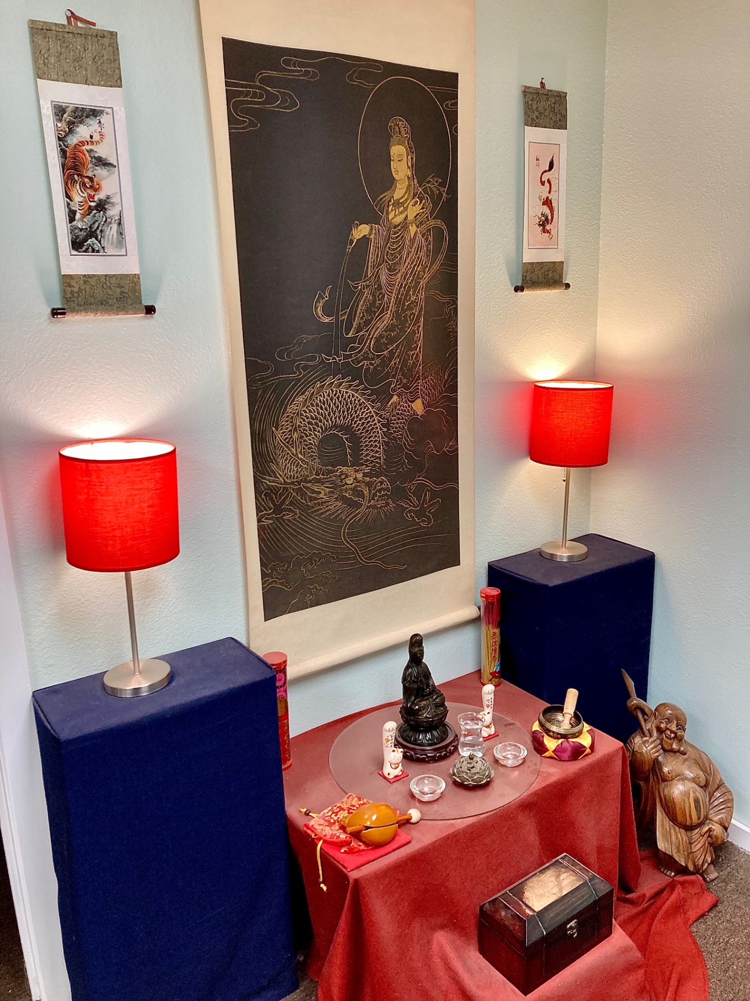 Clinic altar room with Guanyin scroll and traditional decor